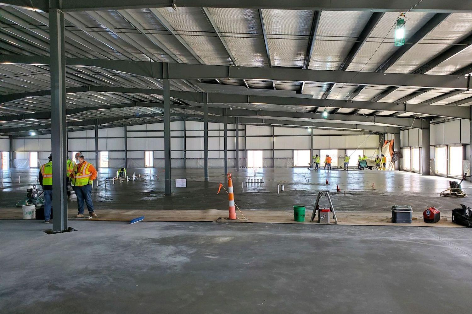 contractors lay low-carbon concrete at Meta data center - sustainability pilot program